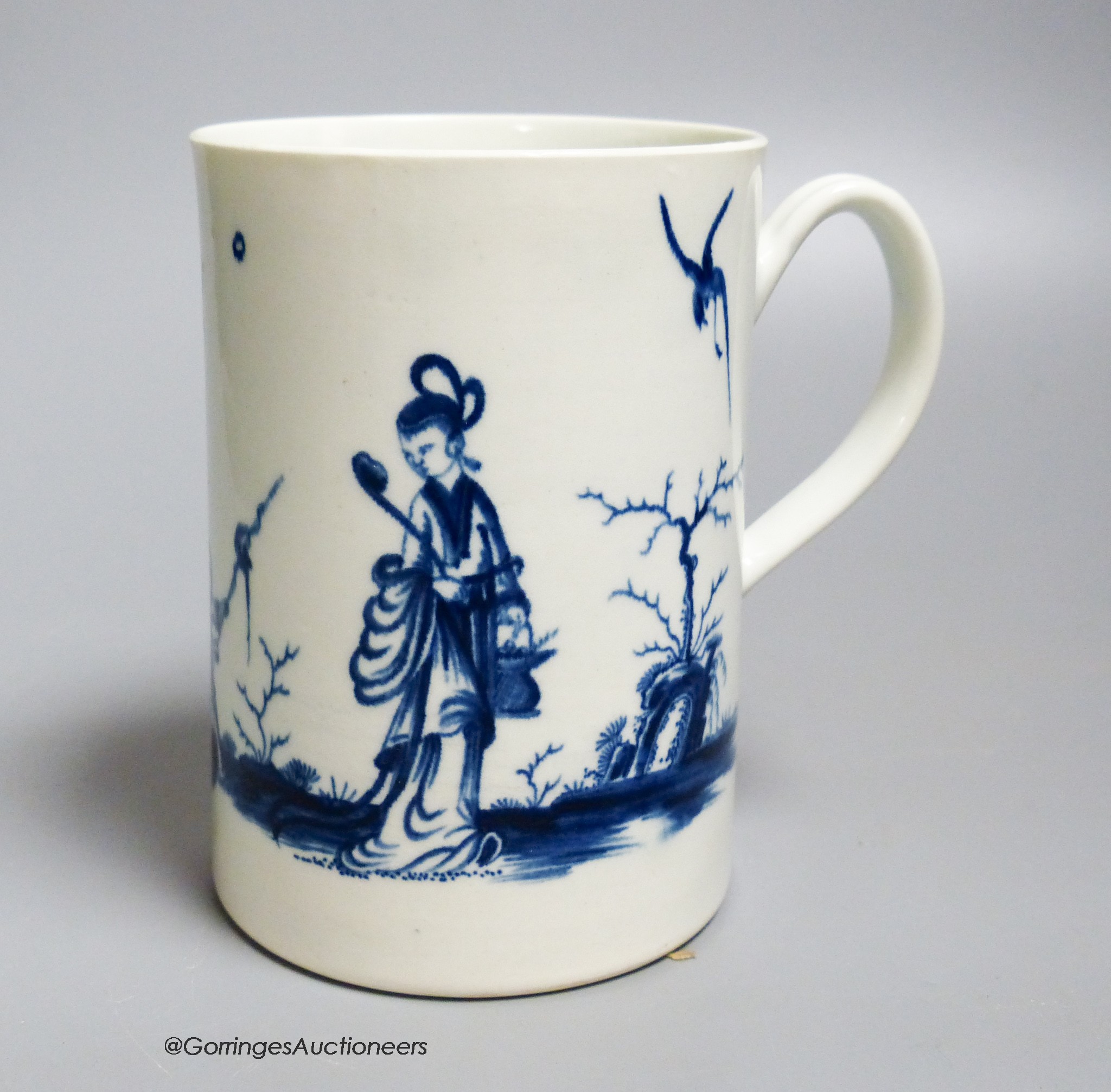 A Worcester 'Walk in the garden' pattern cylinder mug, painted in underglaze blue, open crescent mark, height 12.5cm